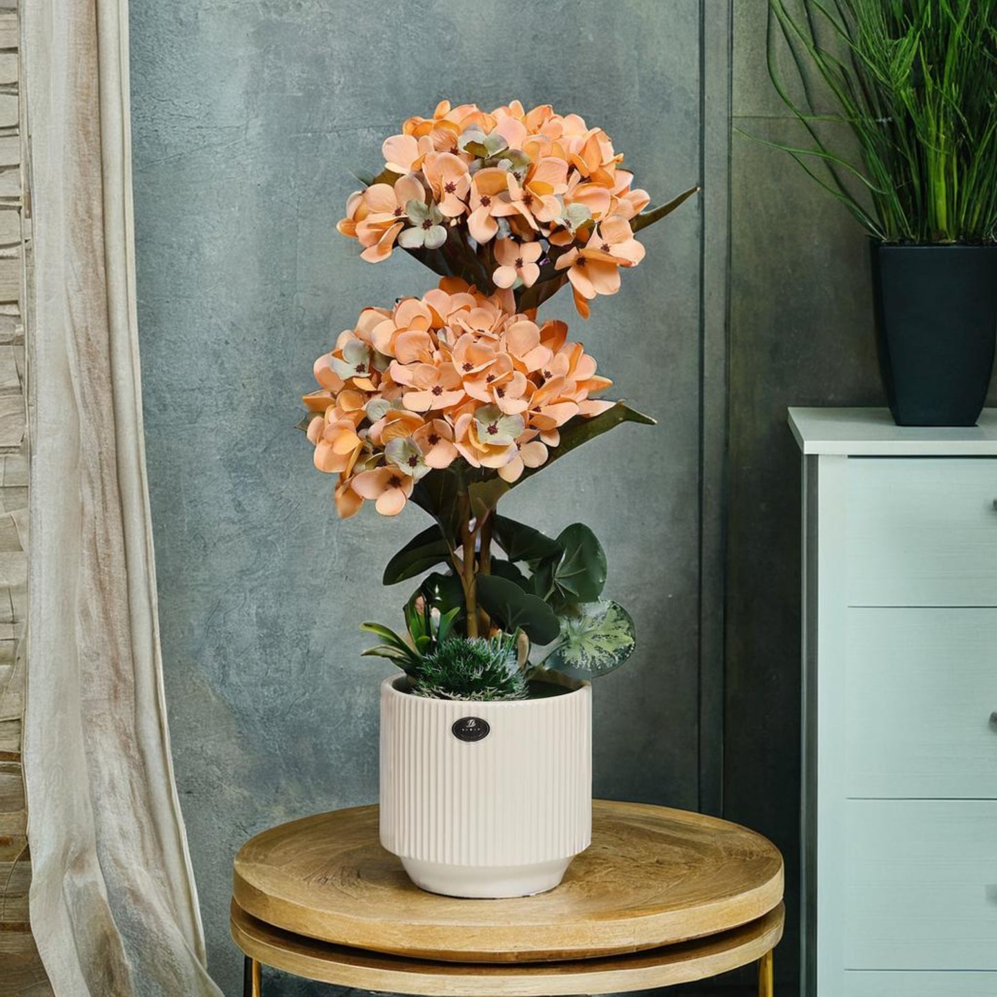 Tiered Bloom: Artificial Peach Hydrangea Arrangement in Ceramic Ribbed Cream Pot