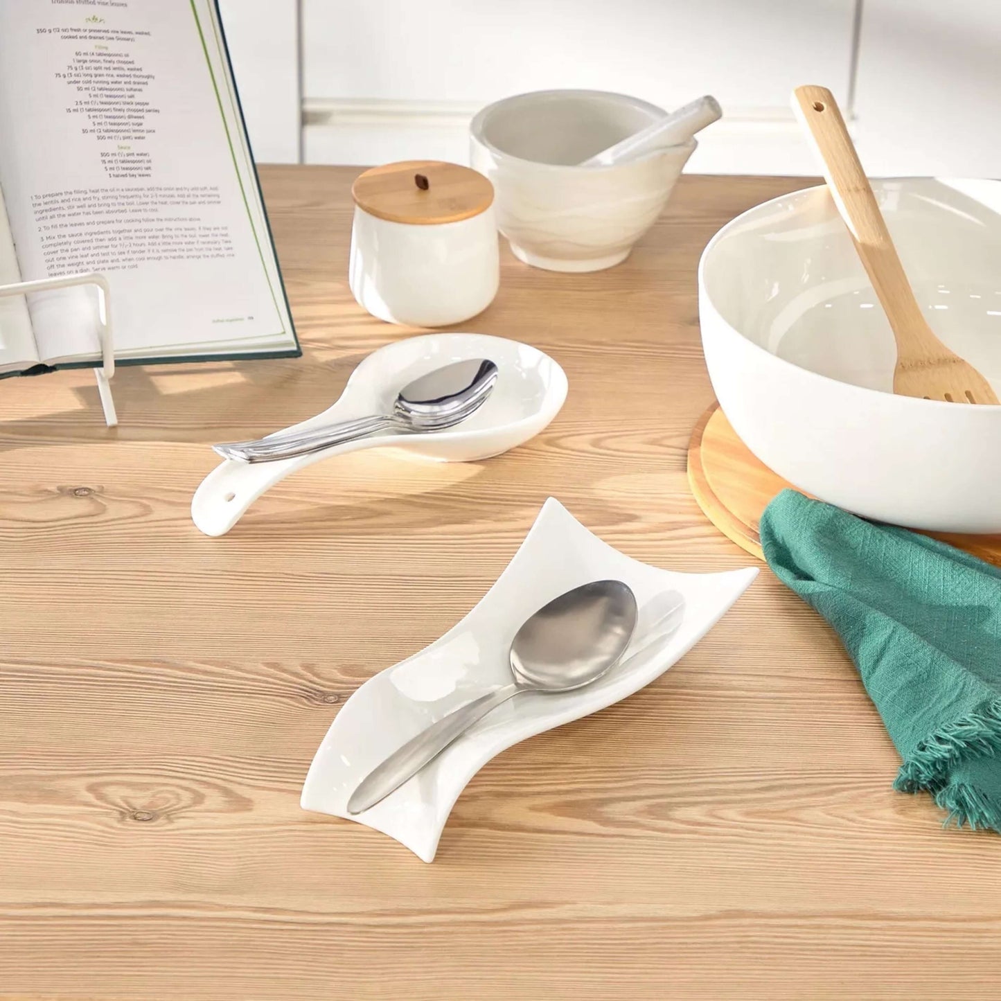 Spoon on a white napkin with a wooden table setting