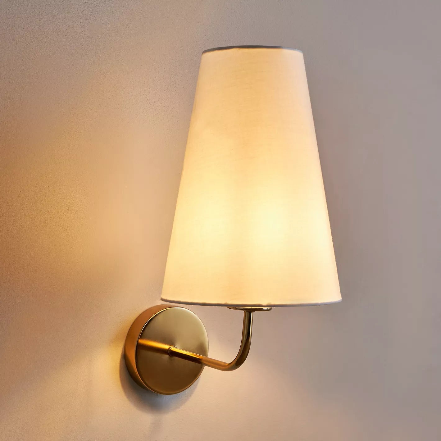 Elegant Gold Wall Sconce with Tapered White Fabric Shade