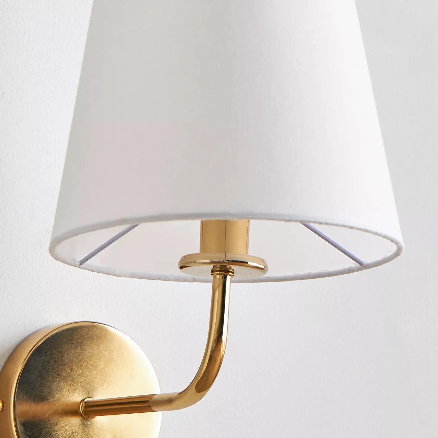 Elegant Gold Wall Sconce with Tapered White Fabric Shade