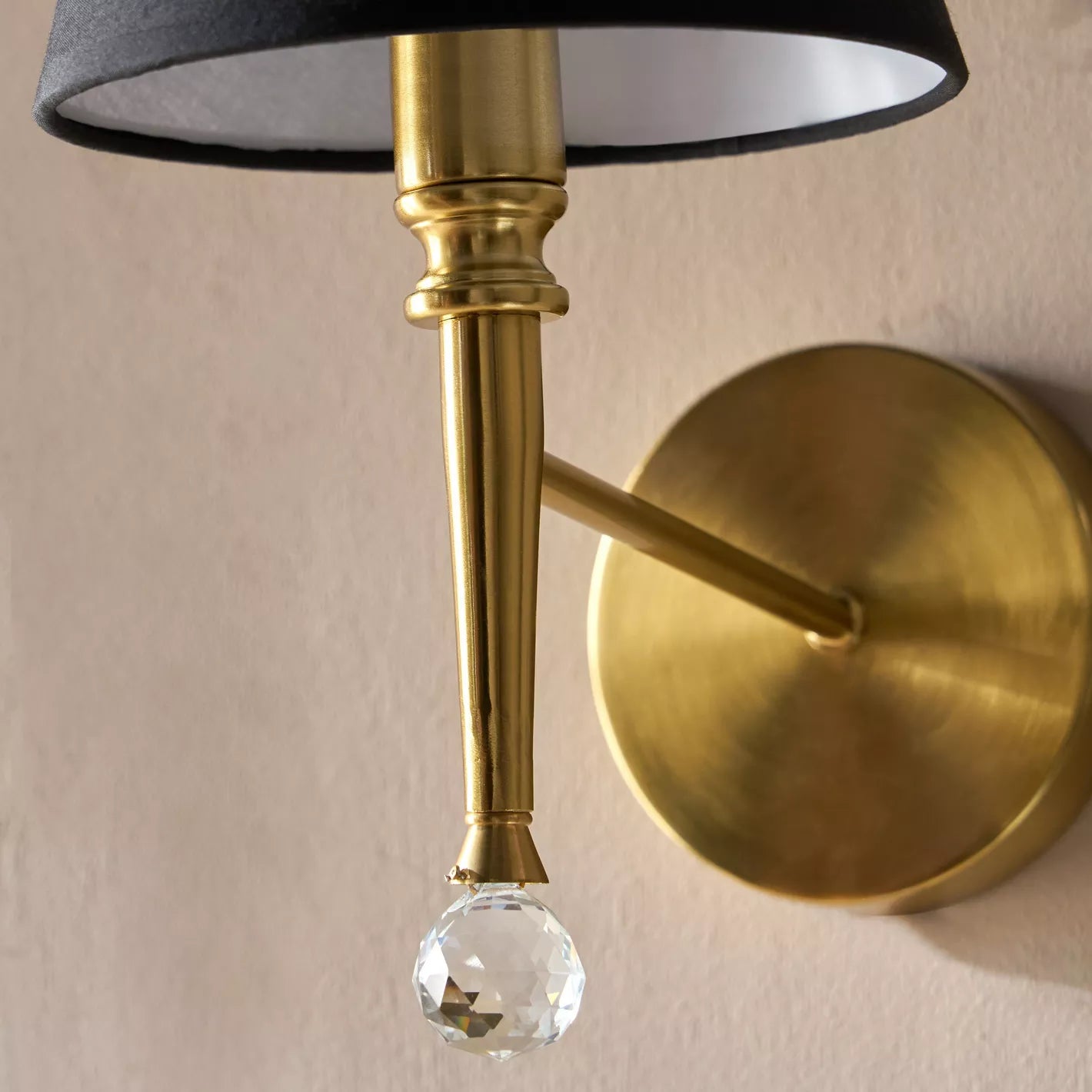 Chic Brass Metal Wall Sconce with Black Shade & Crystal Accent