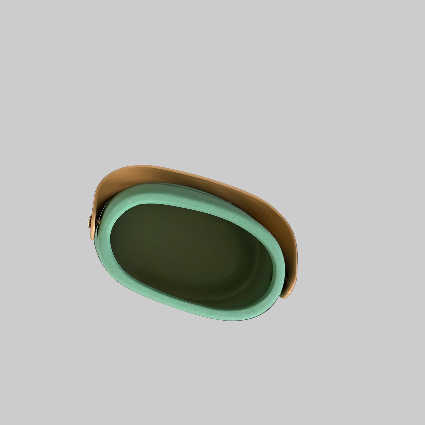 Green and brown oval vase on a light gray background