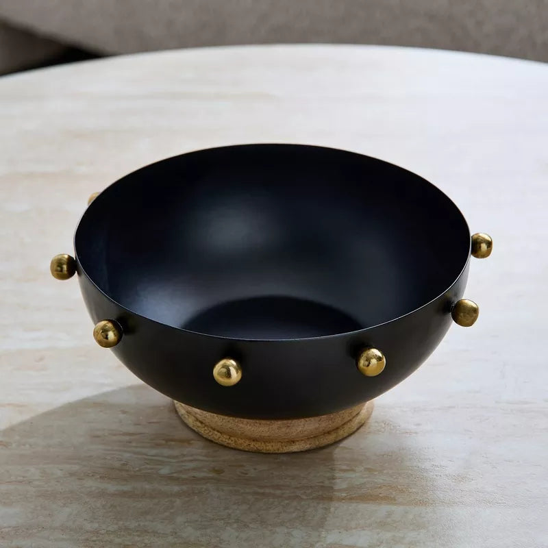 Modern Contrast: Black Metal Bowl with Gold Accents & Wood Base