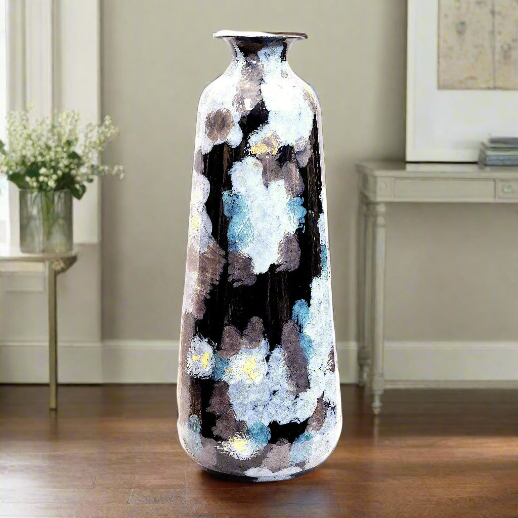Decorative vase with abstract design on a wooden surface and gray background