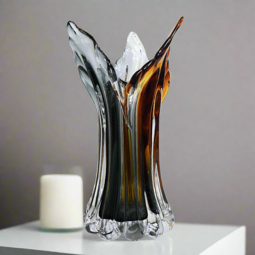 Glass vase with multicolored design on a white background