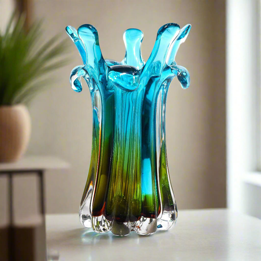 Blue and green glass vase on a white background