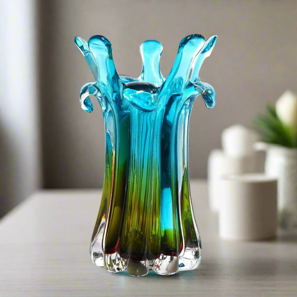 Blue and green glass vase on a white background