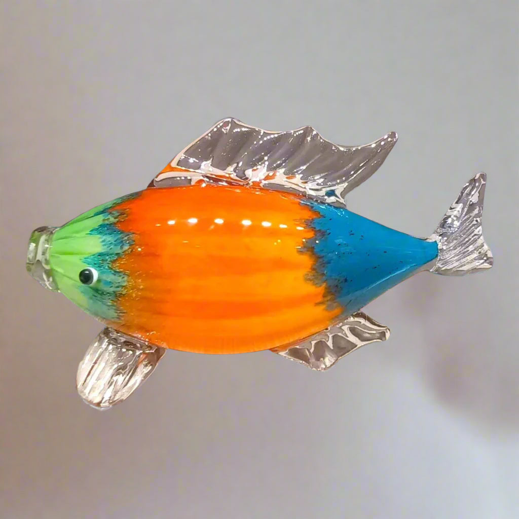 Colorful glass fish figurine on a white background