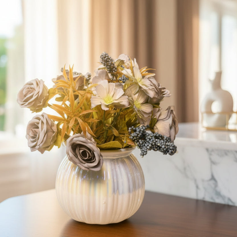 Decorative vase with artificial flowers on a textured surface against a yellow background