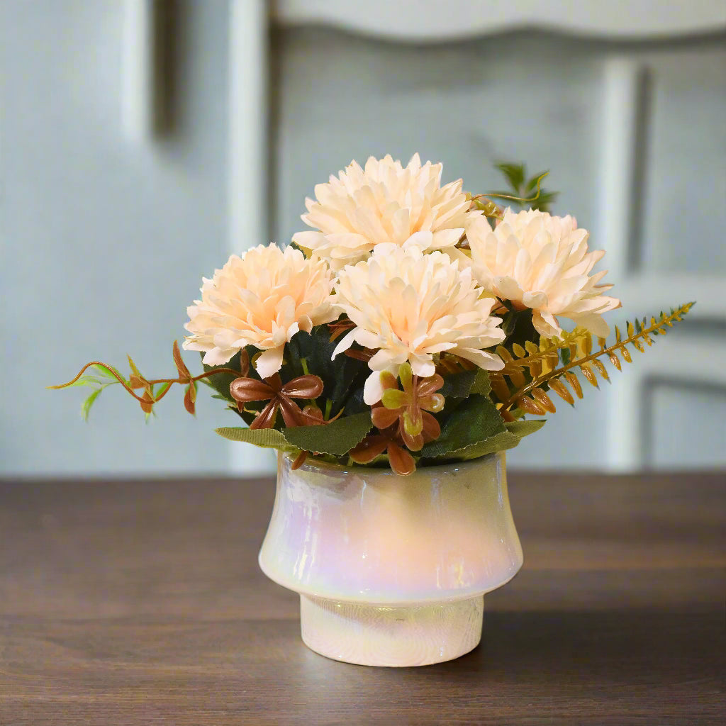 Vase with flowers on a textured surface against a yellow background