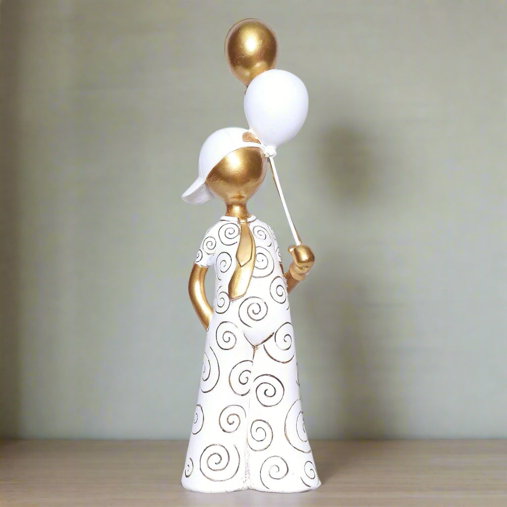 Decorative figurine of a woman holding balloons on a white background