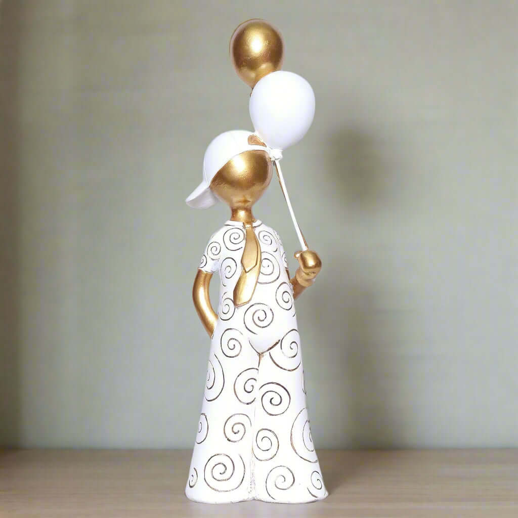 Decorative figurine of a woman holding balloons on a white background