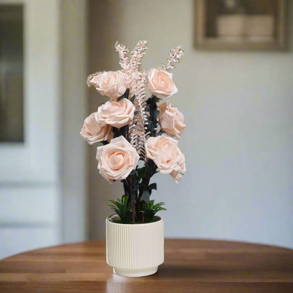 Soft Blush Serenity: Artificial Rose Arrangement in Ceramic Ribbed Pot