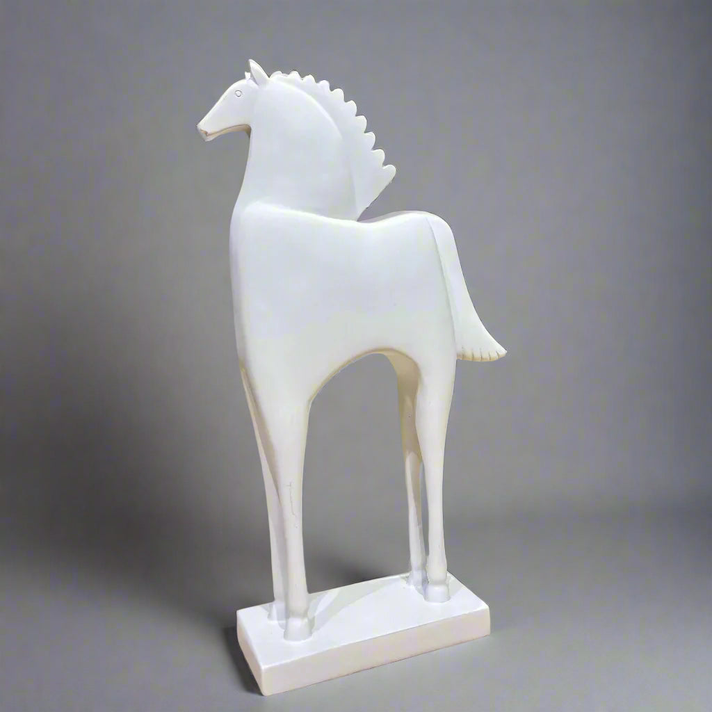 White horse sculpture on a gray background