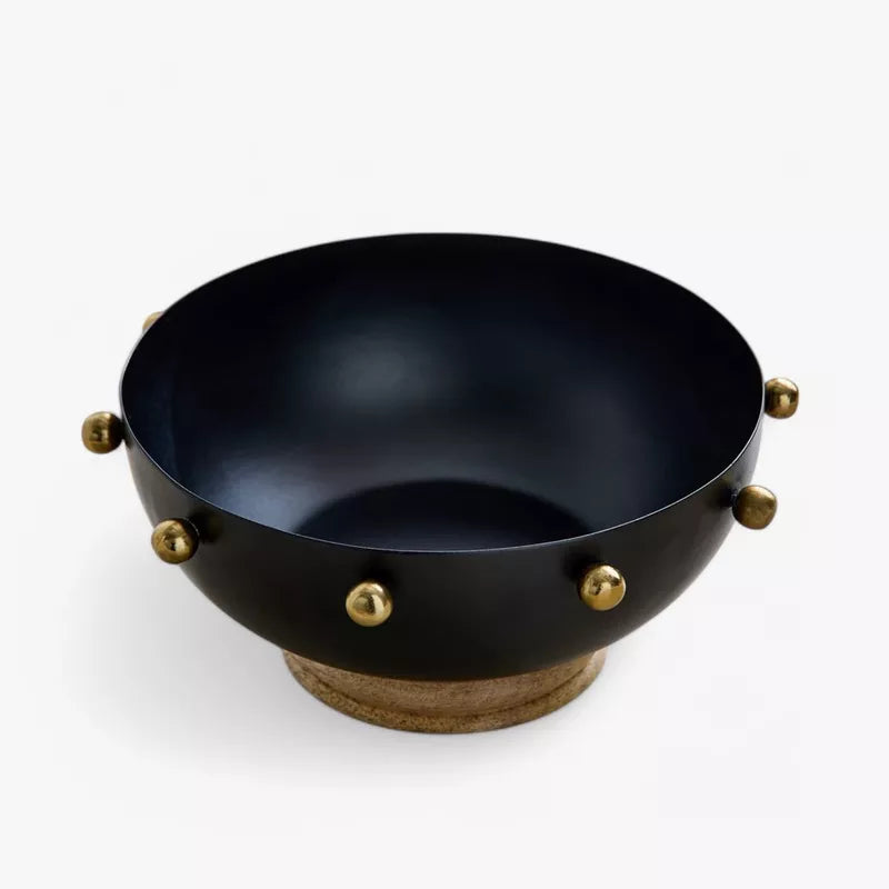 Modern Contrast: Black Metal Bowl with Gold Accents & Wood Base
