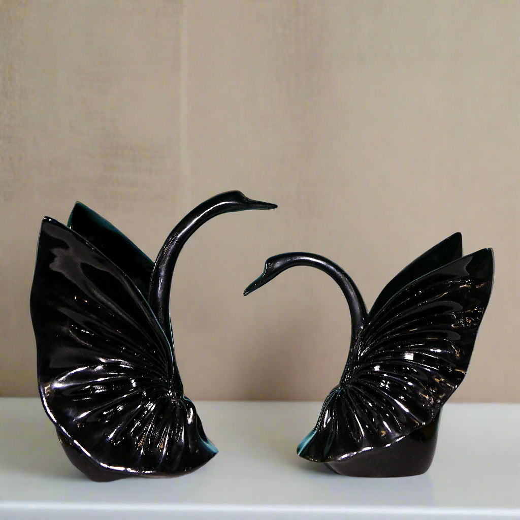 Graceful Embrace: Sculptural Black Swan Pair