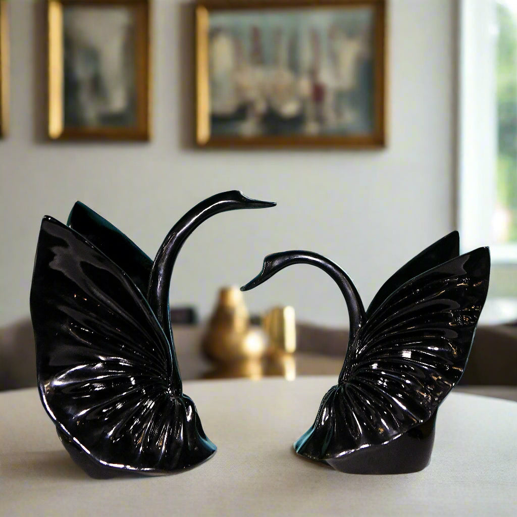 Graceful Embrace: Sculptural Black Swan Pair