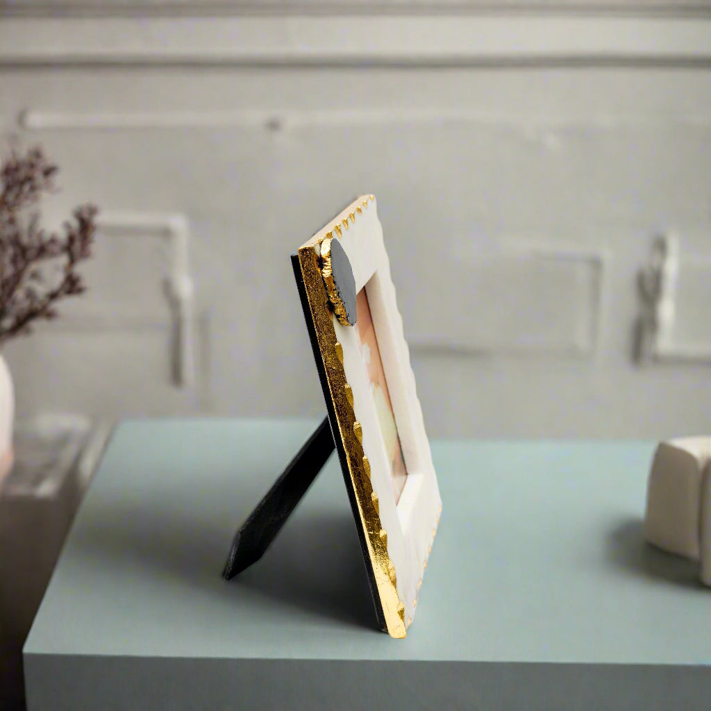 Gold and black photo frame on a white background