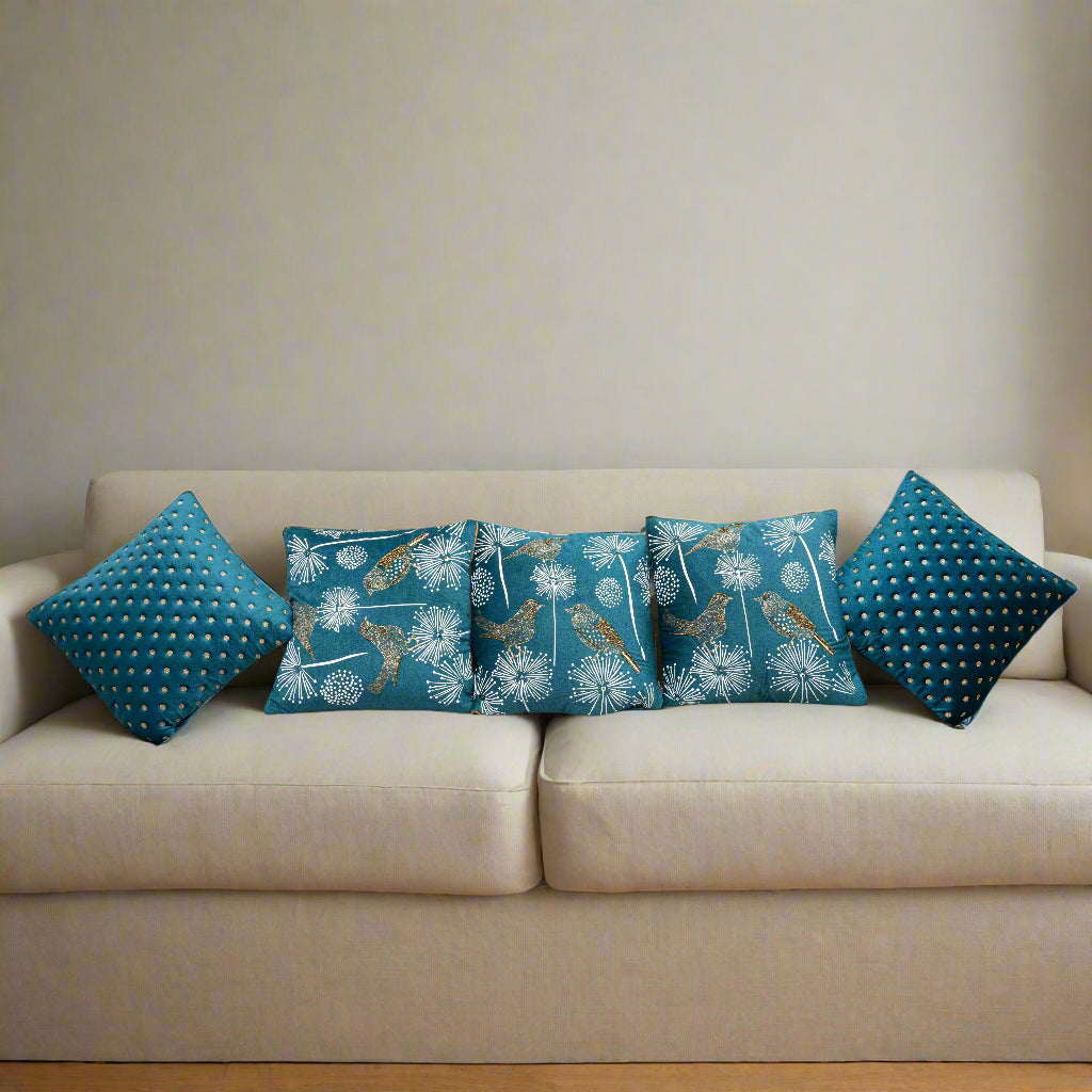 Set of blue patterned cushions on a white sofa