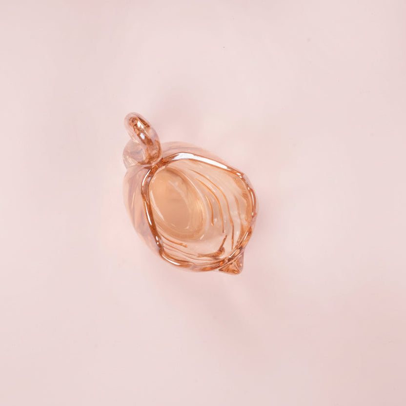 Ethereal Amber Glass Swan Dish from above, showcasing elegant curves and delicate swirling patterns.