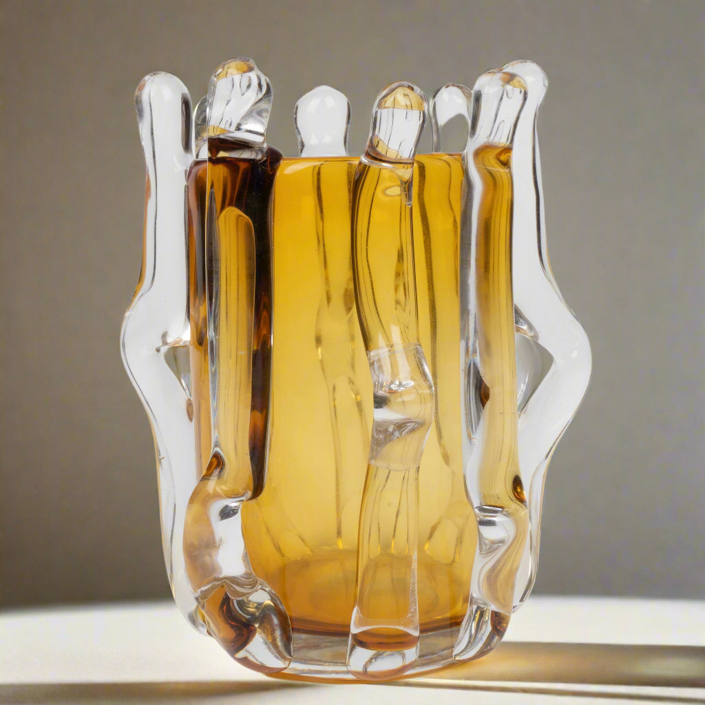 Glass decanter with a unique design on a white background