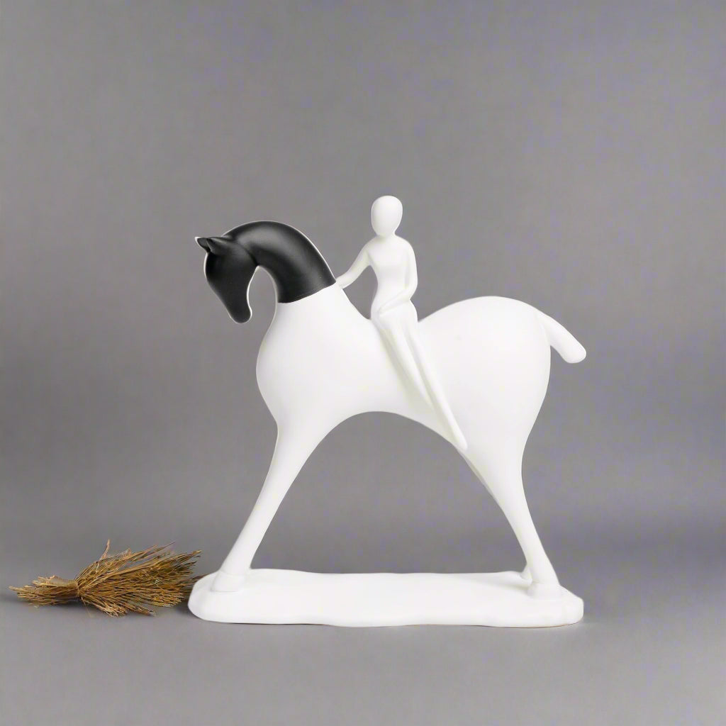 White horse figurine with a rider on a gray background