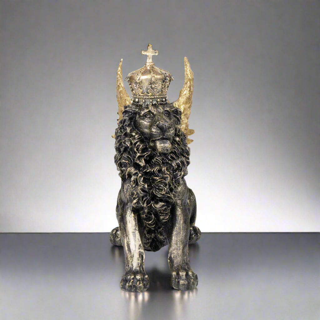 Statue of a lion with a crown and horns on a white background