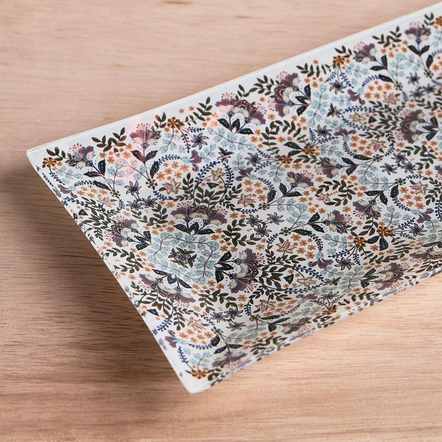 Floral patterned fabric on a wooden surface