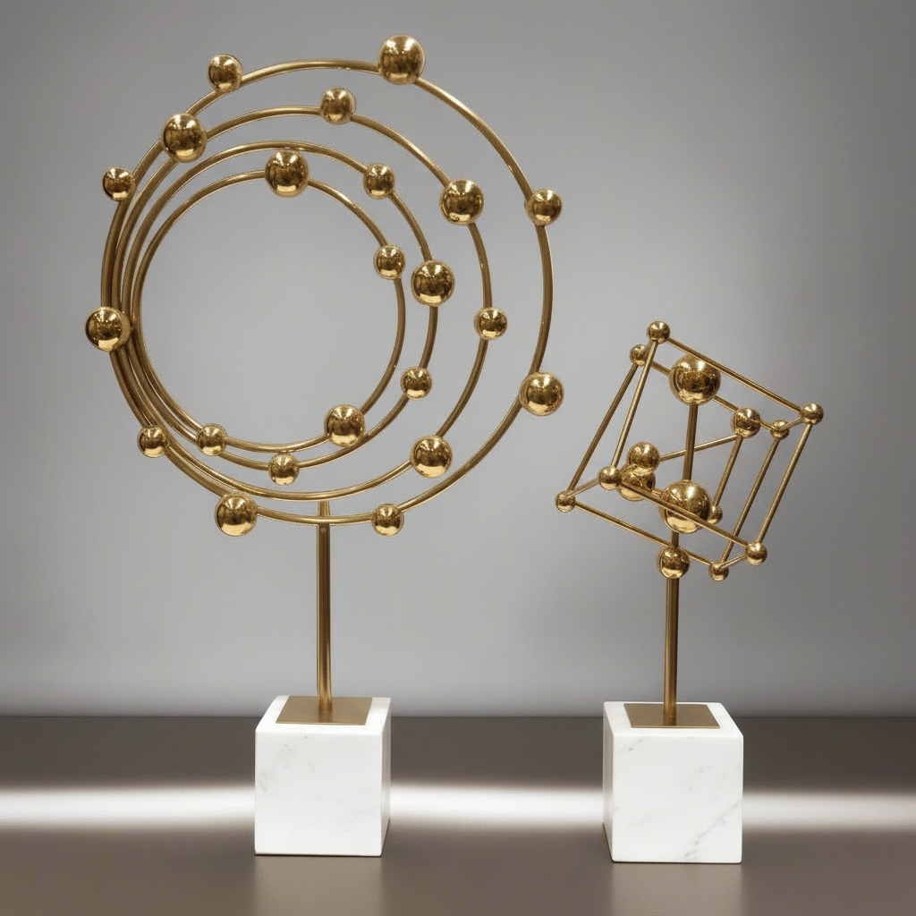 Gold atomic model sculpture on a white base against a gray background