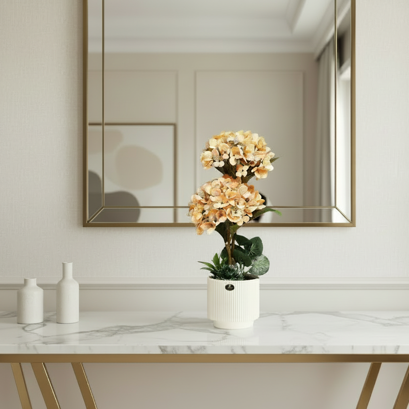 Potted plant with orange flowers on a wooden surface and neutral background