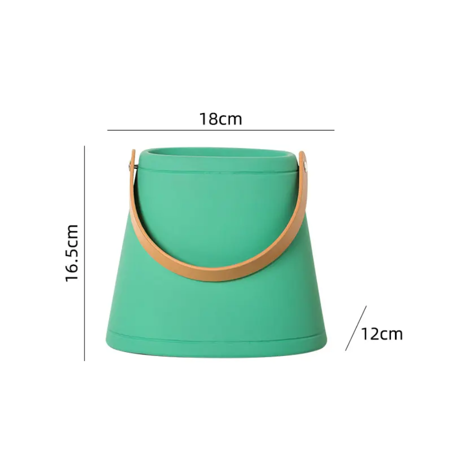 Green bucket with brown handle and measurements on a white background