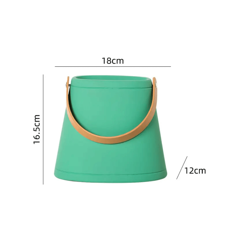 Green bucket with brown handle and measurements on a white background