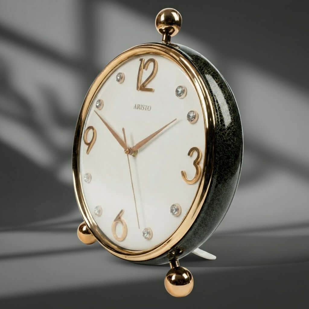 Decorative clock with gold accents on a white background