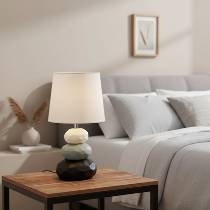 Table lamp with a unique base design on a wooden surface