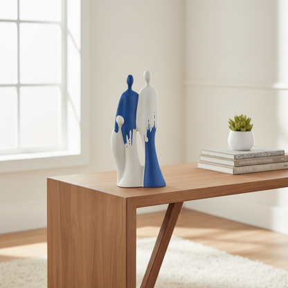 Two ceramic figures, one blue and one white, standing close together on a textured surface with a neutral background.