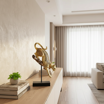 Decorative gold sculpture on a stand in a modern living room.