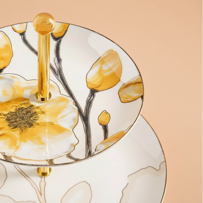 Decorative plate with floral design and gold accents on a beige background