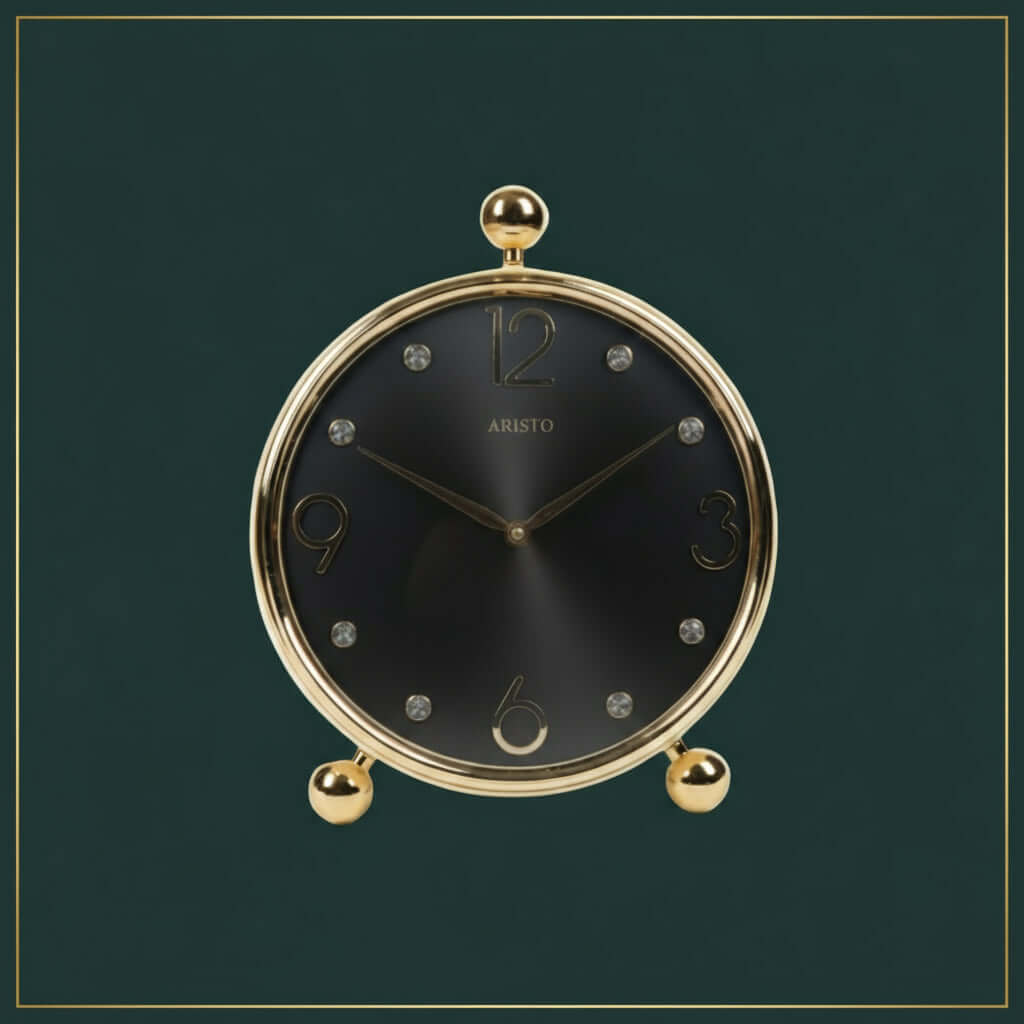 Decorative clock with gold rim and base on a white background