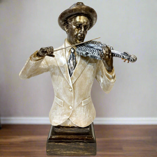 Statue of a man playing a violin on a wooden floor with a neutral background