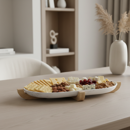 Platter of assorted cheeses and crackers on a wooden table with a blurred background