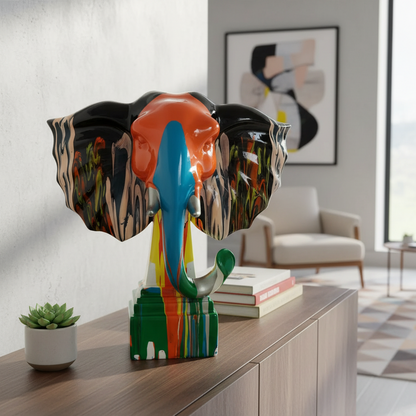 Colorful elephant sculpture on a wooden surface with a modern interior background