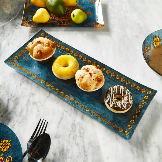 Decorative tray with pastries on a marble surface