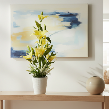 Potted plant with yellow flowers on a gray background