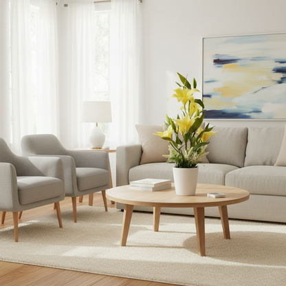 Modern living room with gray sofa, armchairs, and a round wooden coffee table.