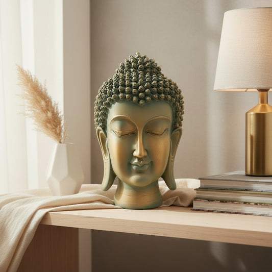 Bronze Buddha head sculpture on a white background