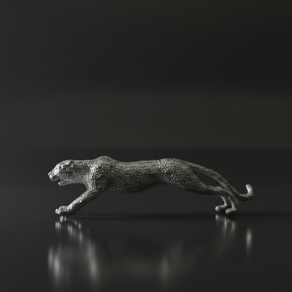 A metallic silver leopard figurine captured in a dynamic running pose, set against a dark reflective background.