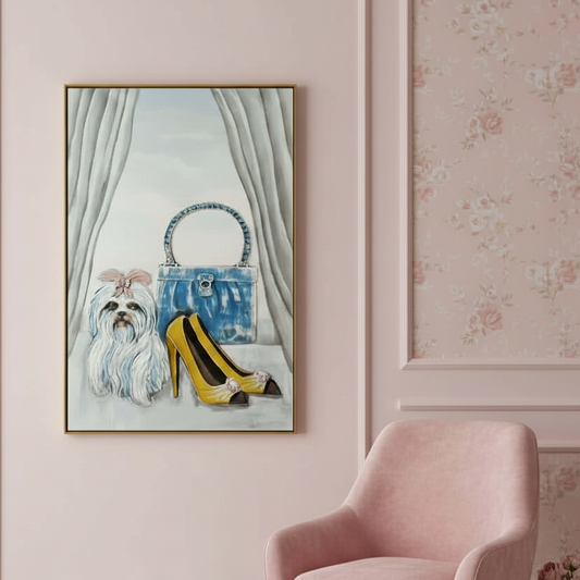 Framed artwork of a dog and high heels on a wall with floral wallpaper