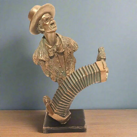 Bronze sculpture of a man with a large sock on his foot against a blue background