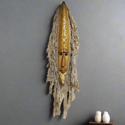 Hand-Carved Tribal Spirit Mask with Ornate Golden Accents
