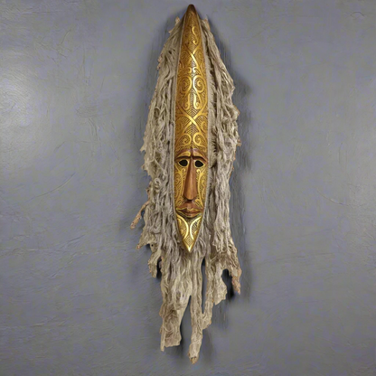 Hand-Carved Tribal Spirit Mask with Ornate Golden Accents